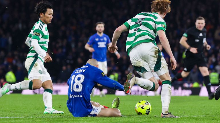 Celtic's Liam Scales pulls down Rangers' Vaclav Cerny at the edge of the penalty box 